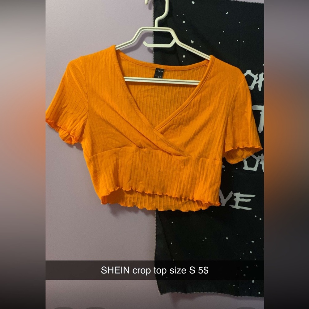 Woman’s orange crop top